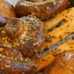 Sauteed garlic mushrooms in frying pan with butter