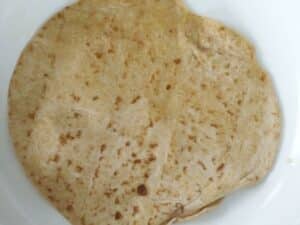 tortilla in frying pan with olive oil