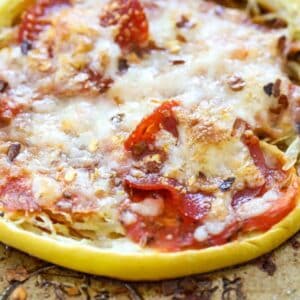 spaghetti squash pizza nests on a baking pan